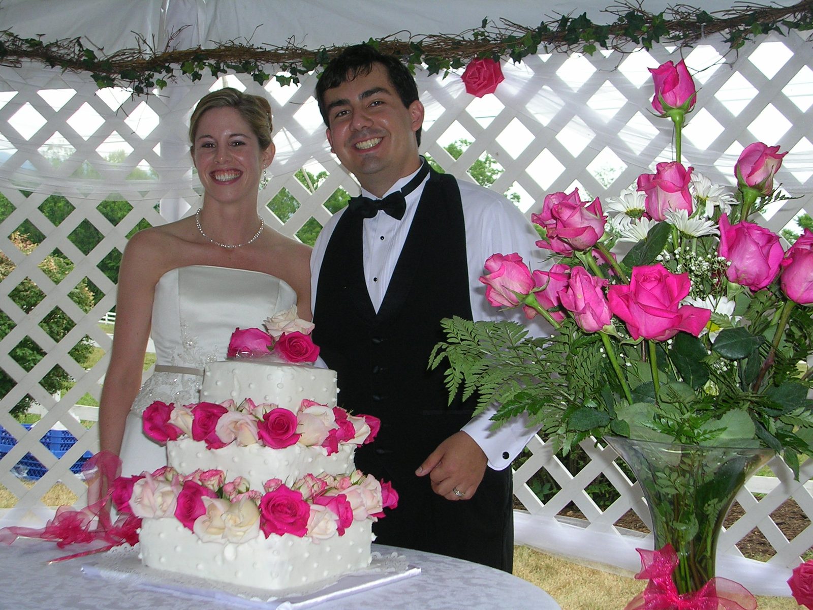 The bride and groom with the cake.